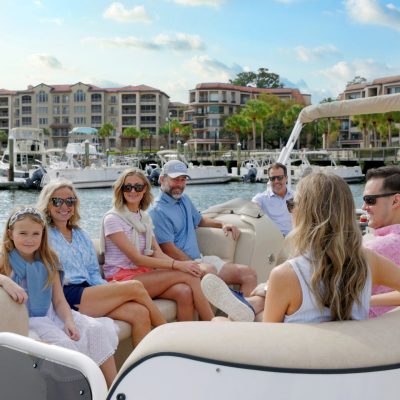 a woman sitting on a boat in the water