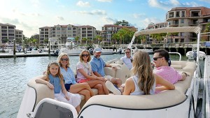 a group of people sitting on a boat