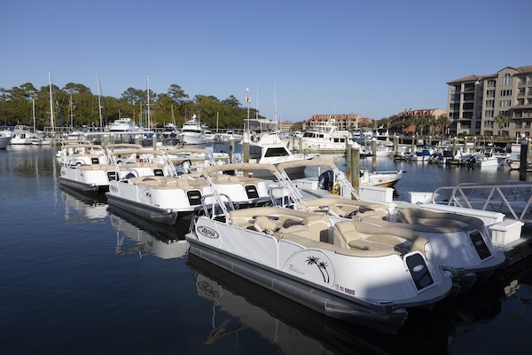 a small boat in a harbor next to a body of water